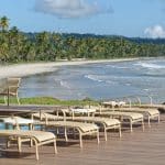 white and gray chairs on seashore during daytime