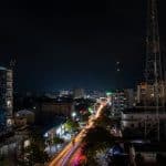 a view of a city at night from the top of a building